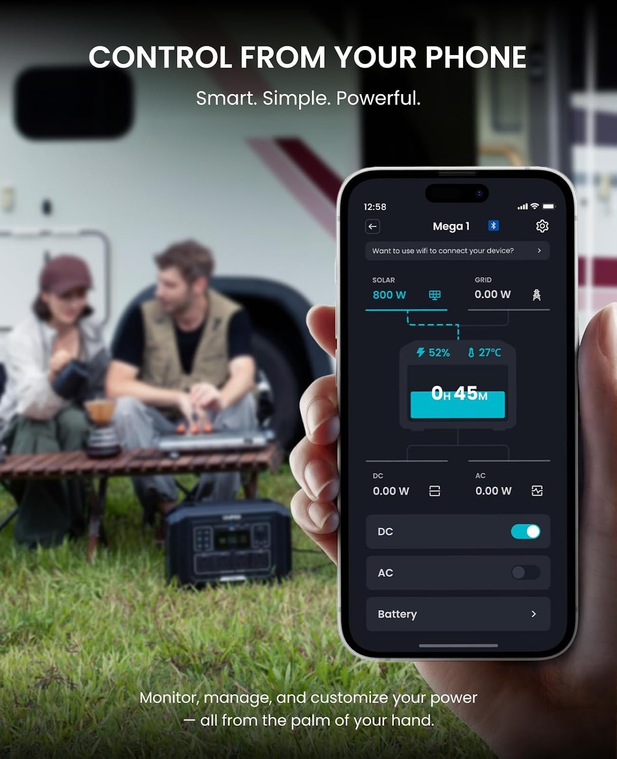 Person holding a smartphone with a power management app displayed, with two people sitting in the background.